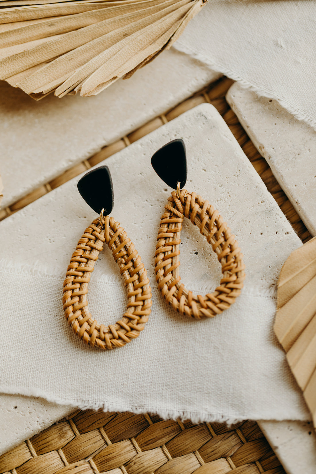 black polymer clay earrings with rattan pendant drops