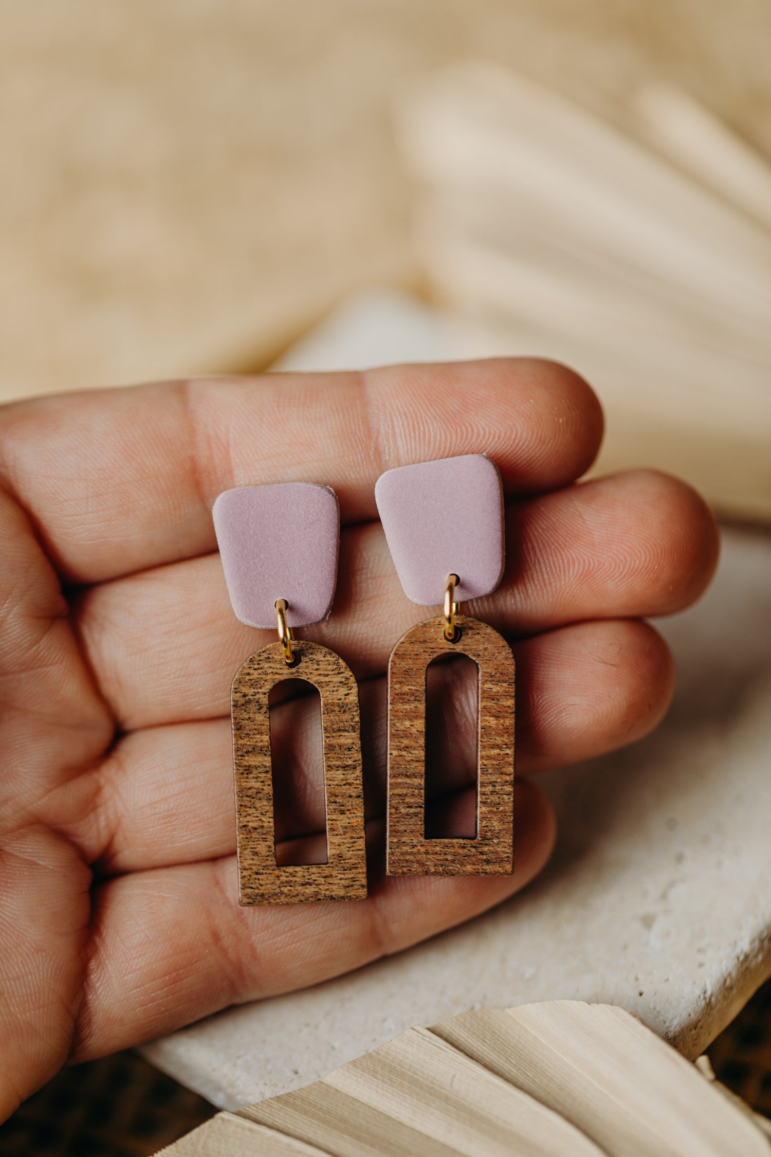 triangular polymer clay earrings in eucalyptus green with rectangular wooden pendant