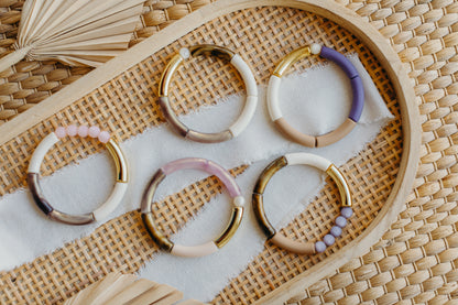 Pearl bracelet with tube pearls in gold, light brown, purple and white