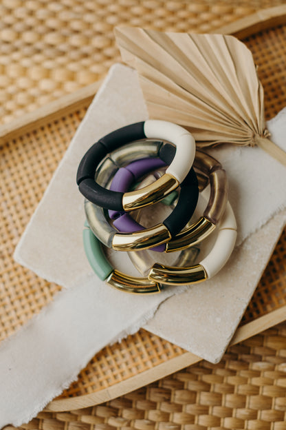 Pearl bracelet with tube pearls in gold, white, and black