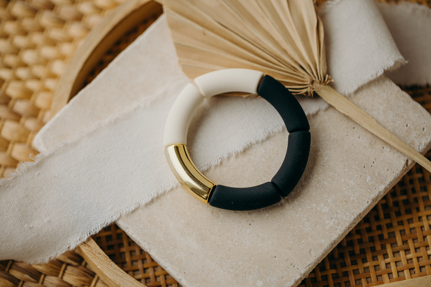 Pearl bracelet with tube pearls in gold, white, and black