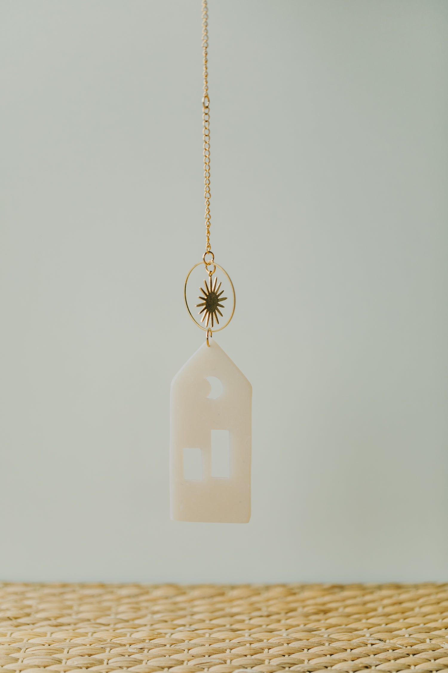 House pendant made of polymer clay with brass element