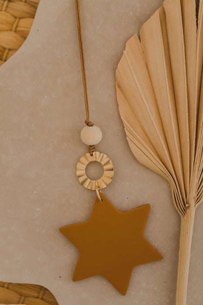 Christmas star pendant made of polymer clay