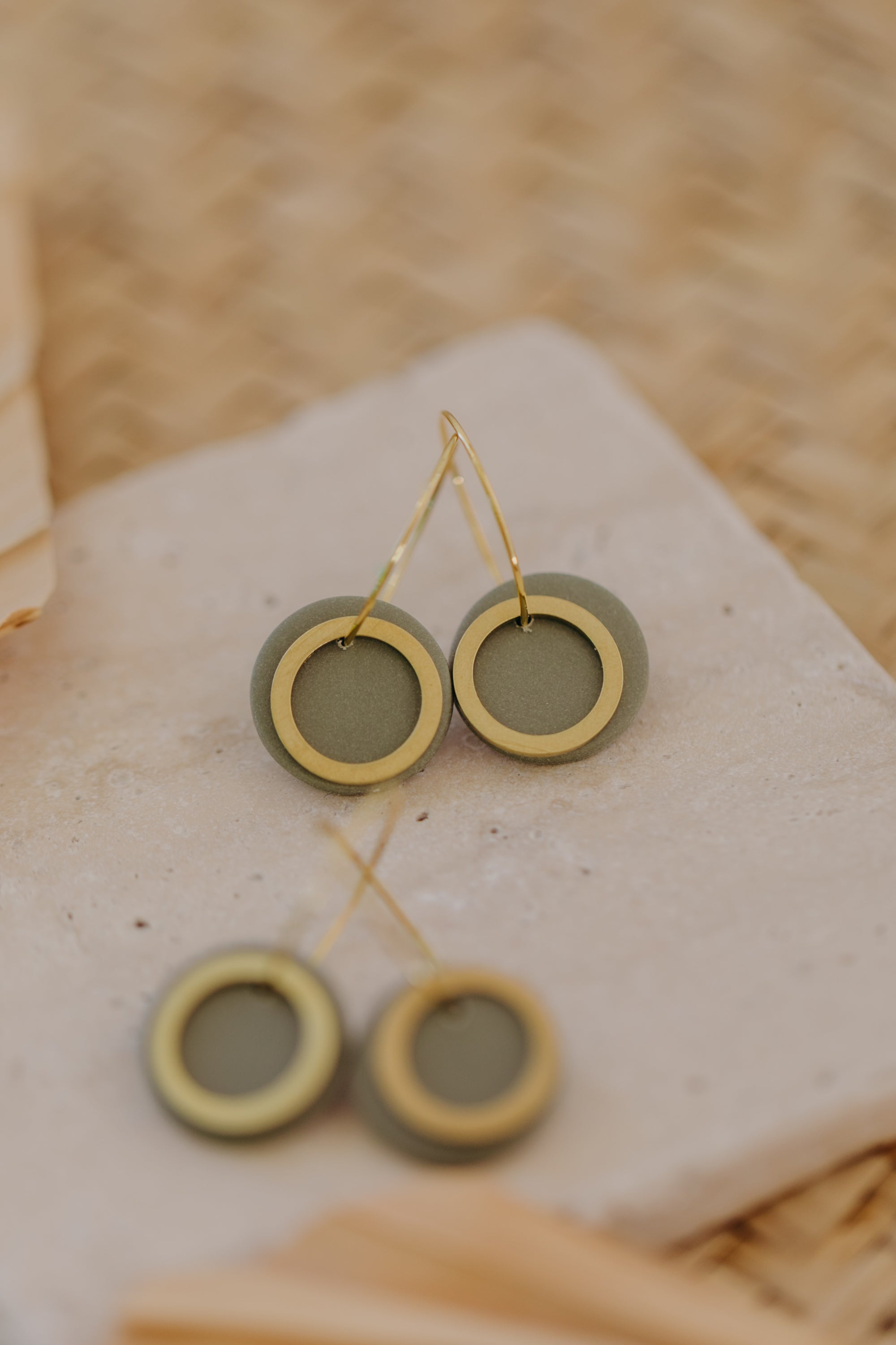 Hoop earrings with round polymer clay pendant and leaf