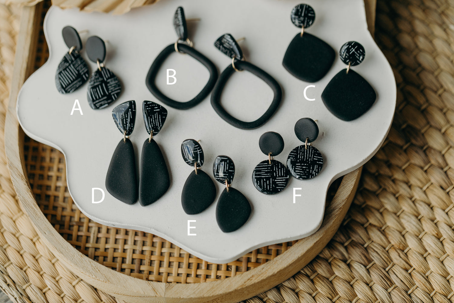 black polymer clay earrings with white pattern